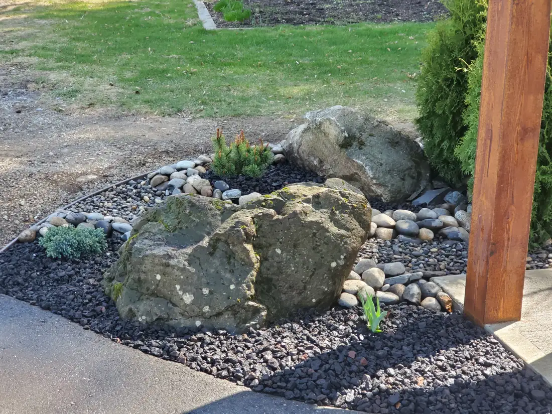 Decorative rockwork with feature boulders, river rock and black lava stone, Salmon Arm BC