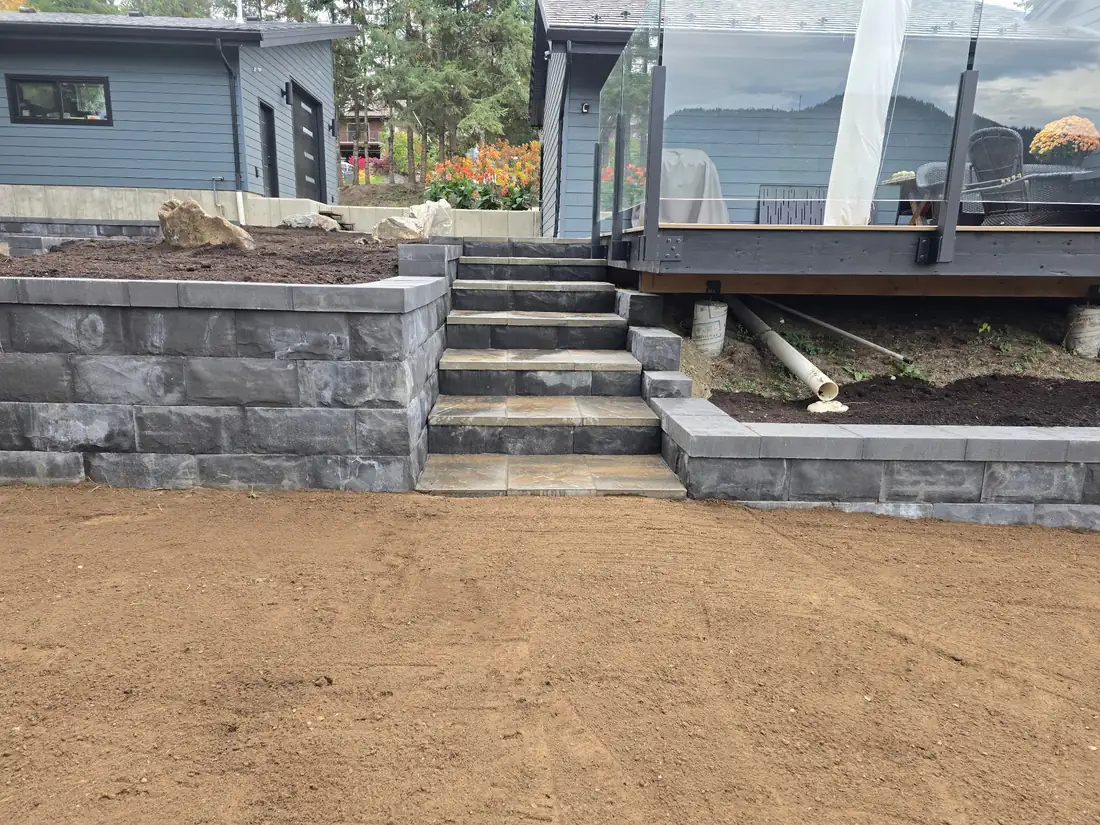 Terraced charcoal block retaining wall with steps, Shuswap BC