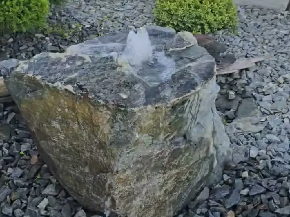 Drilled-boulder bubbler water feature in basalt rock, Shuswap BC